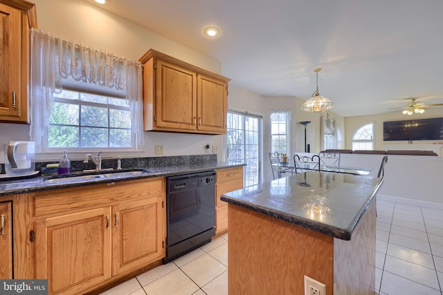 kitchen with black dishwasher, a center island, sink, and plenty of natural light