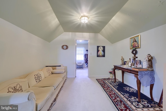 living room with light carpet and vaulted ceiling