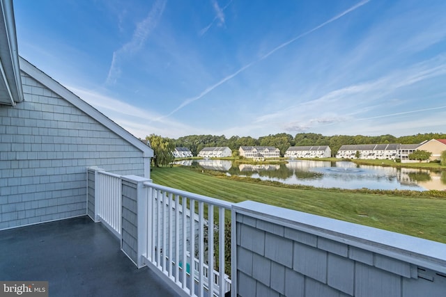 balcony featuring a water view