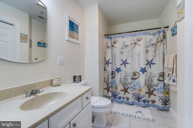 bathroom with vanity, toilet, tile patterned floors, and a shower with curtain