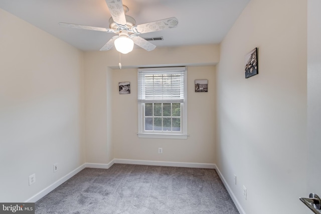 unfurnished room with ceiling fan and carpet flooring