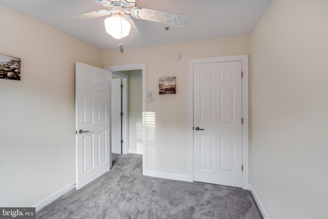 unfurnished bedroom with light carpet and ceiling fan