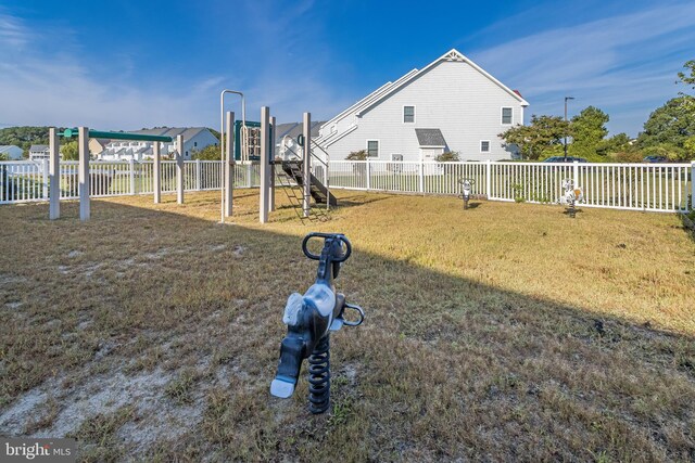 view of jungle gym with a lawn