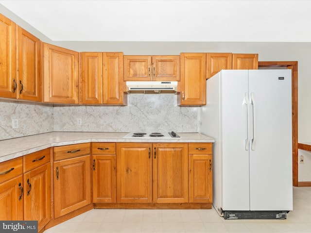 kitchen featuring white appliances and tasteful backsplash