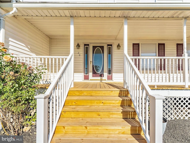 doorway to property with a porch