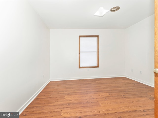 empty room featuring hardwood / wood-style floors