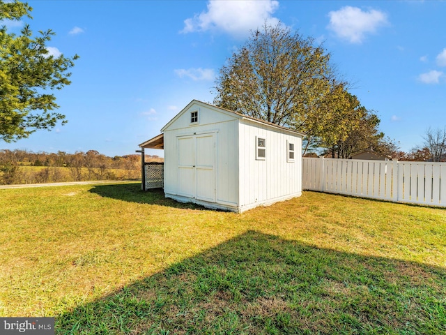 view of outbuilding featuring a yard