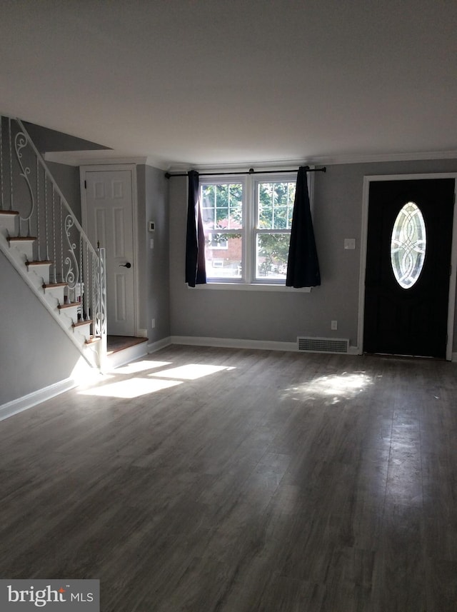 foyer with dark hardwood / wood-style floors