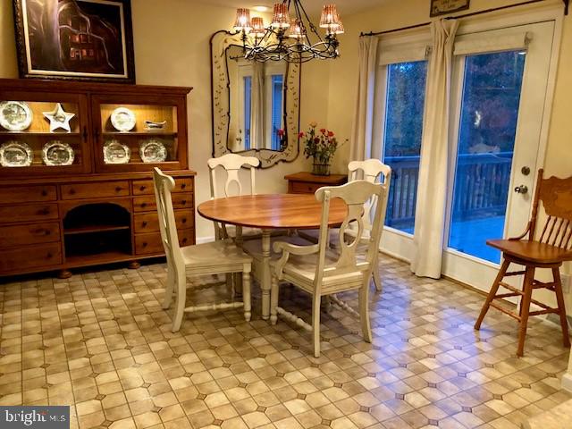 dining room featuring a notable chandelier