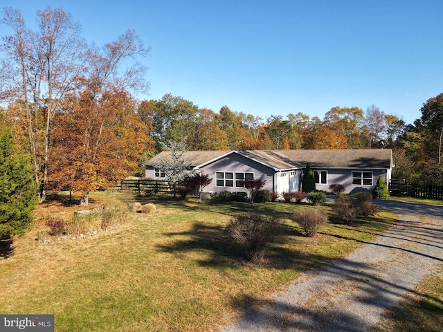 ranch-style home with a front yard