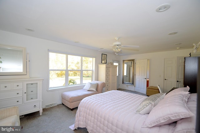 bedroom with light colored carpet and ceiling fan