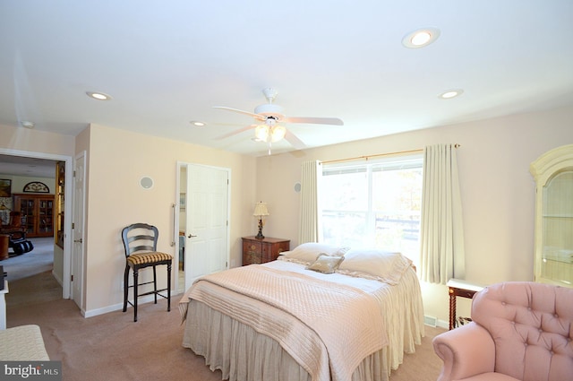 bedroom with light colored carpet and ceiling fan