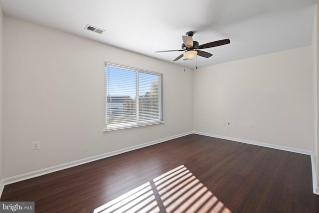 unfurnished room with ceiling fan and dark hardwood / wood-style floors