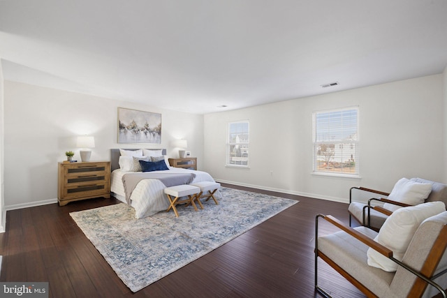 bedroom with dark wood-type flooring