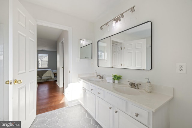 bathroom featuring vanity and hardwood / wood-style flooring