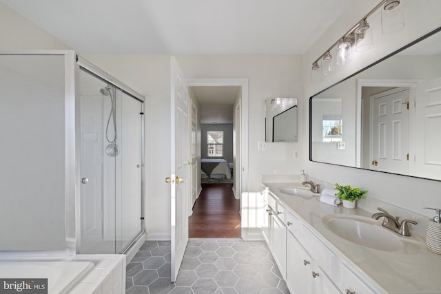 bathroom with vanity, independent shower and bath, and tile patterned flooring