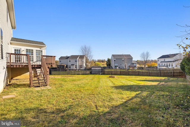 view of yard with a wooden deck