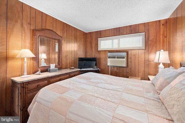 12 128th St Unit 2, Ocean City, MD 21842 - bedroom with wood walls, a textured ceiling, and an AC wall unit