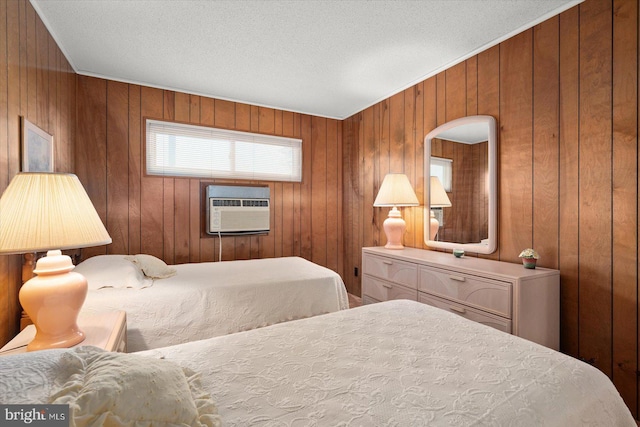 bedroom with a textured ceiling and wooden walls