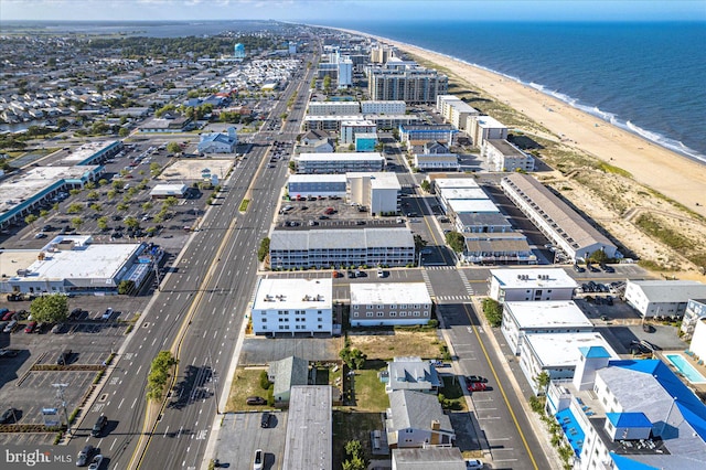 birds eye view of property with a view of the beach and a water view