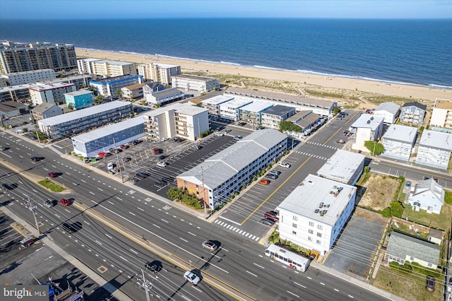 aerial view featuring a water view and a beach view