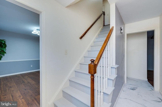 staircase featuring hardwood / wood-style floors