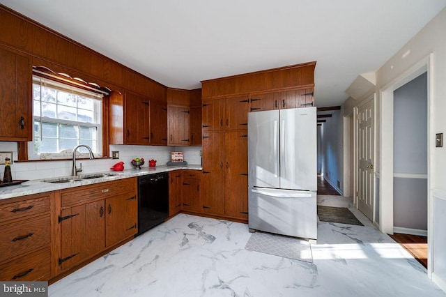 kitchen with stainless steel fridge, sink, decorative backsplash, and dishwasher