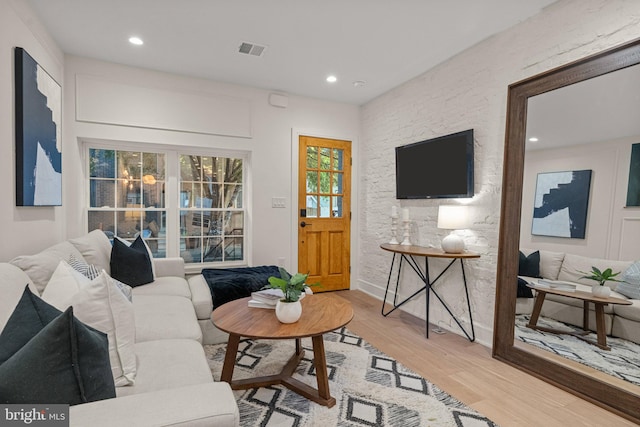 living room with light hardwood / wood-style floors