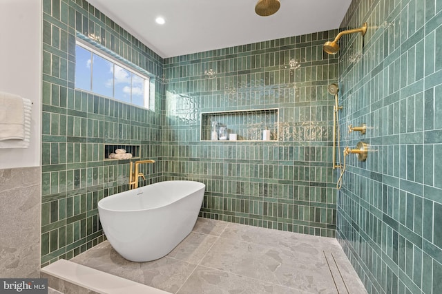 bathroom with independent shower and bath and tile walls