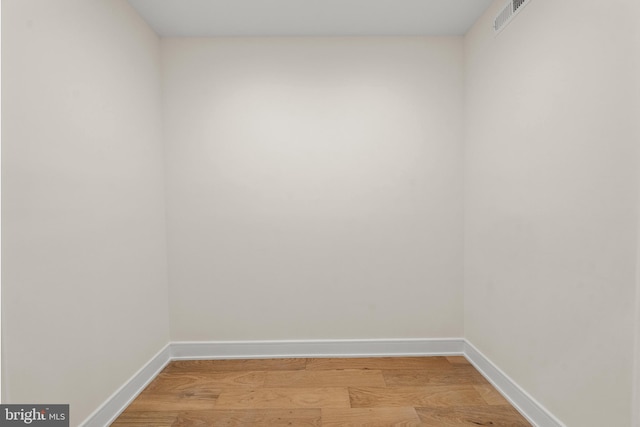 unfurnished room with light hardwood / wood-style flooring