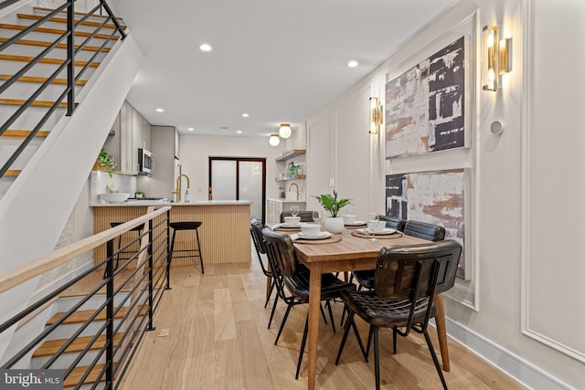 dining room with light hardwood / wood-style flooring