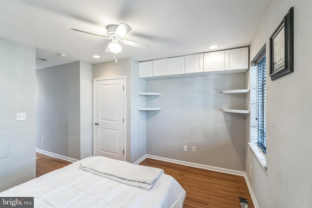 bedroom featuring dark hardwood / wood-style flooring and ceiling fan