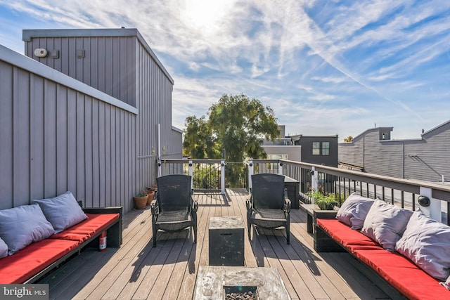 wooden deck featuring an outdoor hangout area