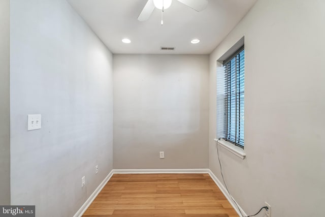 unfurnished room featuring light hardwood / wood-style floors and ceiling fan