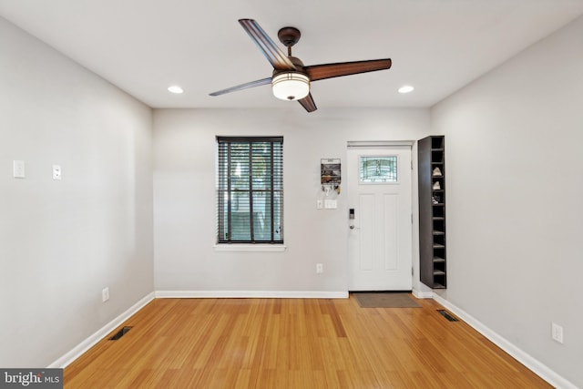 entryway featuring wood-type flooring and ceiling fan