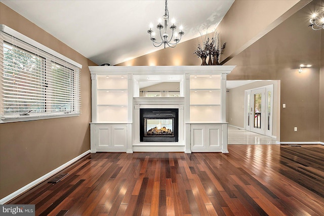 39 Admiral Ave, Ocean Pines, MD 21811 - unfurnished living room featuring wood-type flooring, a chandelier, lofted ceiling, a multi sided fireplace, and baseboards