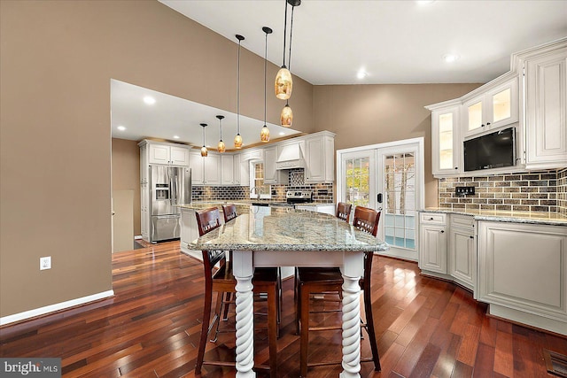 39 Admiral Ave, Ocean Pines, MD 21811 - kitchen with stainless steel appliances, a kitchen island, dark wood finished floors, tasteful backsplash, and high vaulted ceiling