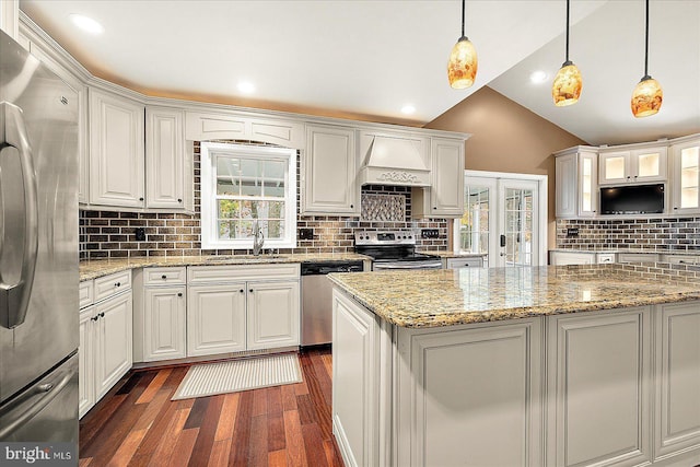 39 Admiral Ave, Ocean Pines, MD 21811 - kitchen featuring appliances with stainless steel finishes, a sink, dark wood-type flooring, tasteful backsplash, and white cabinetry