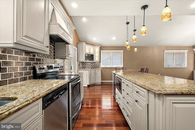 39 Admiral Ave, Ocean Pines, MD 21811 - kitchen with appliances with stainless steel finishes, premium range hood, white cabinetry, dark wood-style floors, and tasteful backsplash