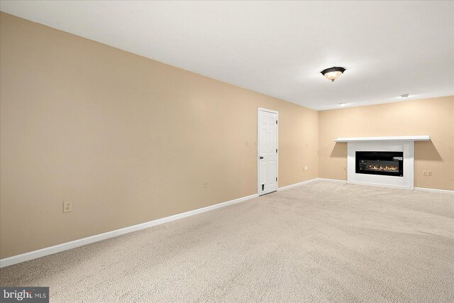 unfurnished living room with carpet