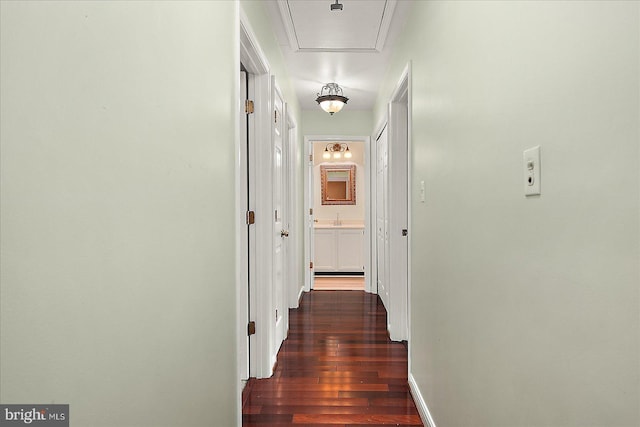 39 Admiral Ave, Ocean Pines, MD 21811 - hall with wood finished floors, attic access, a sink, and baseboards