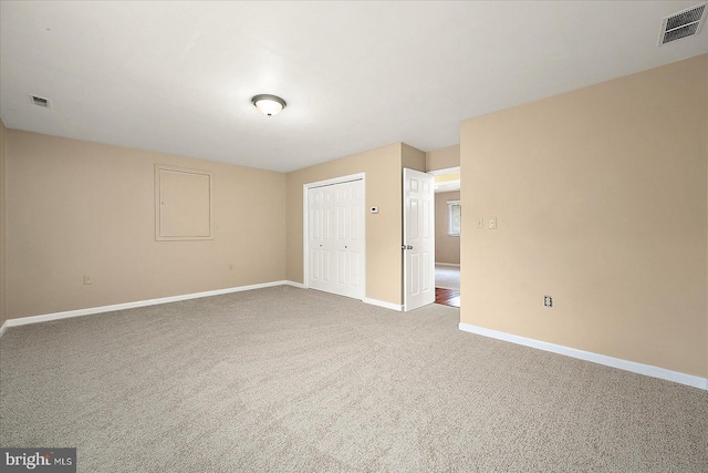 unfurnished room with carpet floors