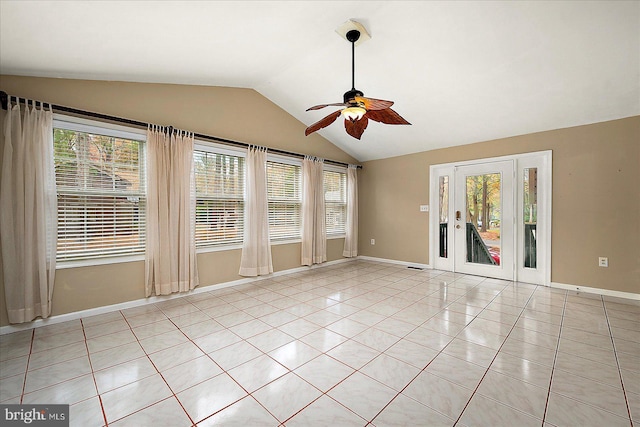 39 Admiral Ave, Ocean Pines, MD 21811 - empty room featuring a ceiling fan, vaulted ceiling, healthy amount of natural light, light tile patterned floors, and baseboards