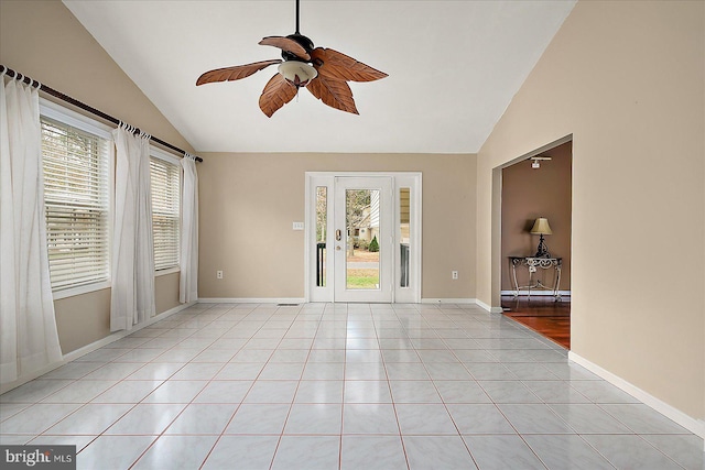 tiled spare room with ceiling fan and lofted ceiling