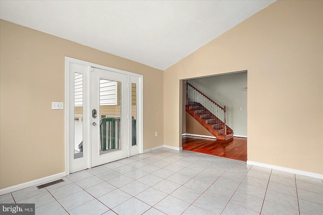 39 Admiral Ave, Ocean Pines, MD 21811 - empty room with stairway, lofted ceiling, baseboards, and light tile patterned flooring