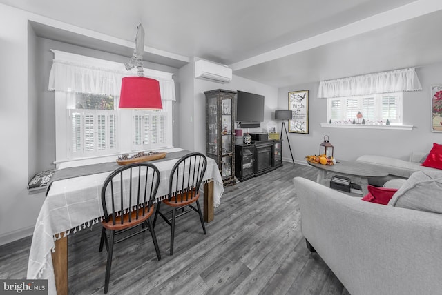 interior space with a wall unit AC and hardwood / wood-style floors