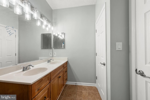 bathroom with tile patterned flooring and vanity