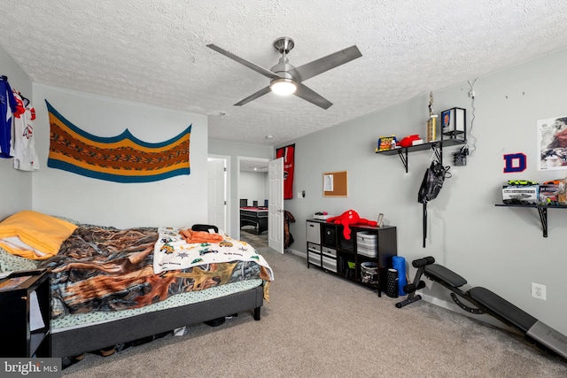 carpeted bedroom featuring a textured ceiling and ceiling fan