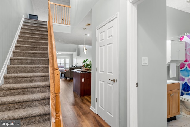 stairway featuring hardwood / wood-style floors