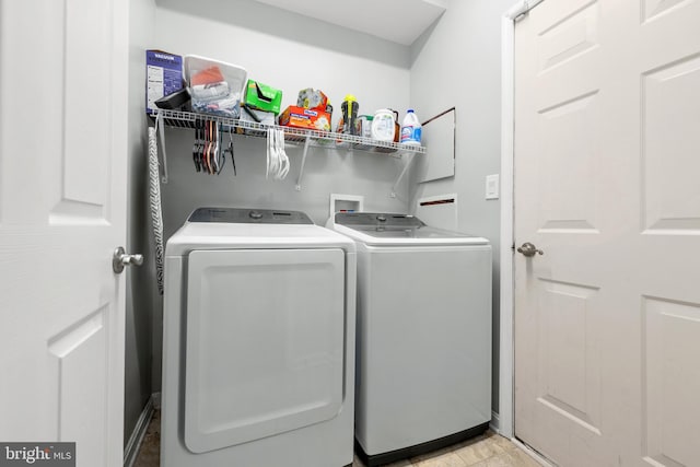 laundry area with washer and clothes dryer